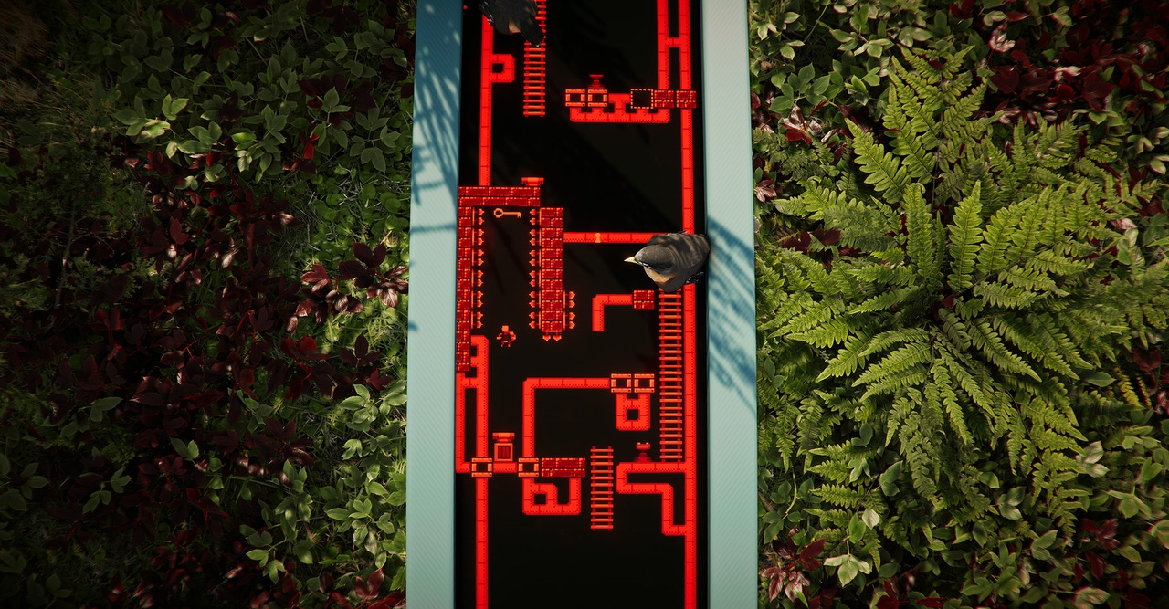 A complex array of red platforming segments is playing on a screen amongst some foliage. A bird sits on the screen A complex array of red platforming segments is playing on a screen amongst some foliage. A bird sits on the screen