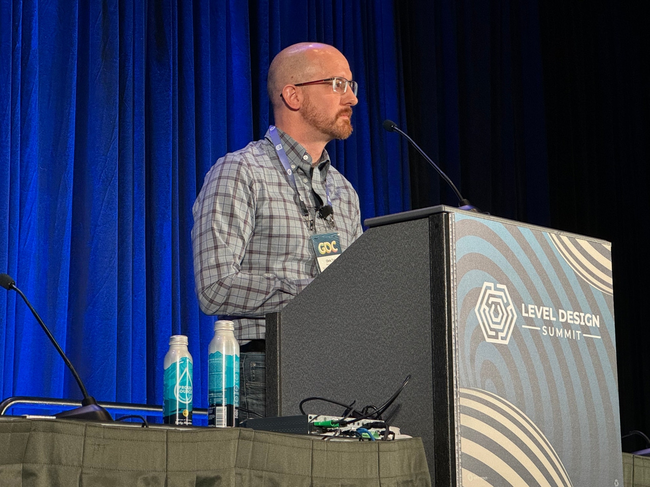 Developer and professor Christopher Totten at the GDC podium Developer and professor Christopher Totten at the GDC podium