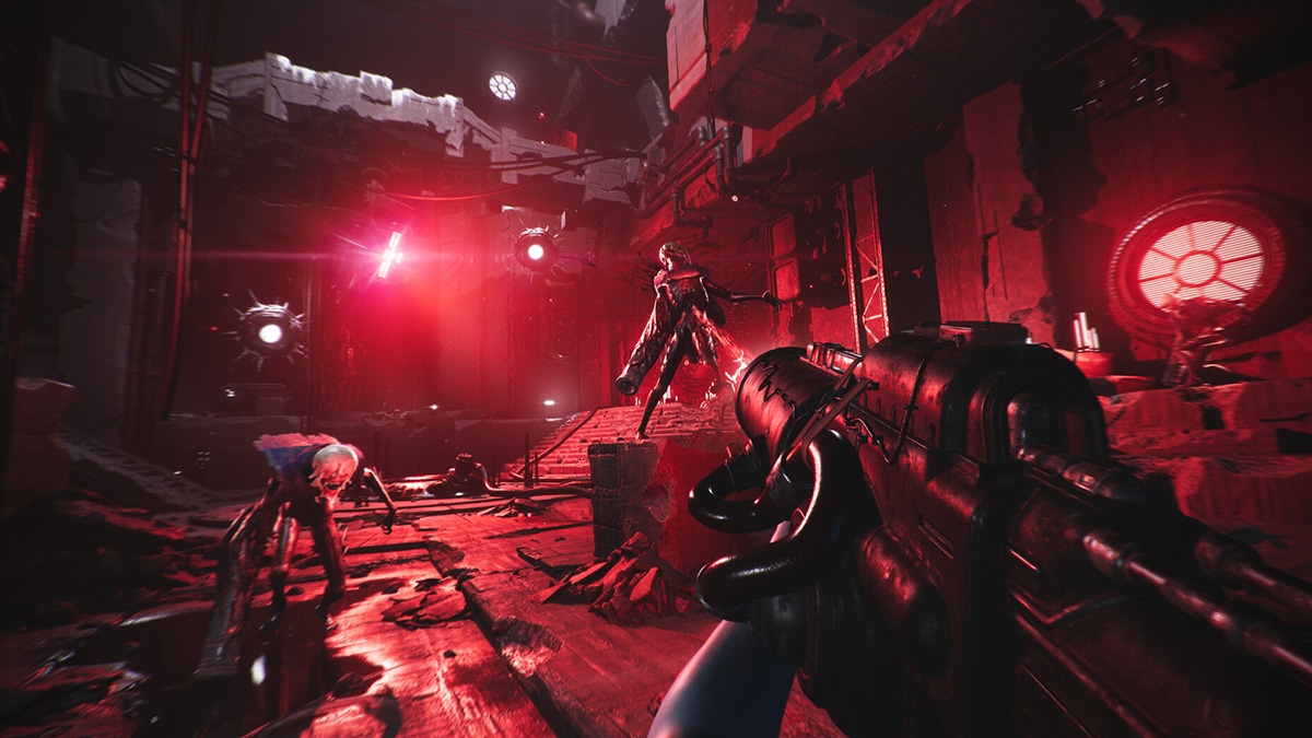 A screenshot from Luna Abyss featuring enemies in a crimson red corridor A screenshot from Luna Abyss featuring enemies in a crimson red corridor