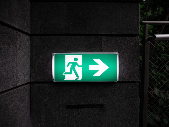 A photo of a green exit sign