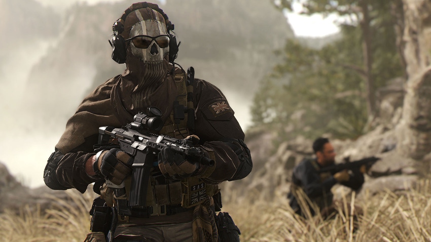 A screenshot from Call of Duty showing two soldiers advancing through a field