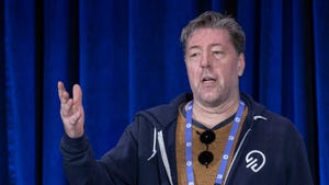 A photograph of Julian LeFay giving a talk during GDC 2024 A photograph of Julian LeFay giving a talk during GDC 2024