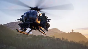 A screenshot of Wardogs, showing a chopper mid flight with a group of armed players inside. A screenshot of Wardogs, showing a chopper mid flight with a group of armed players inside.