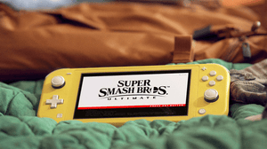 The Nintendo Switch lite, lying on a couch The Nintendo Switch lite, lying on a couch