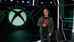 Phil Spencer in front of the Xbox logo.