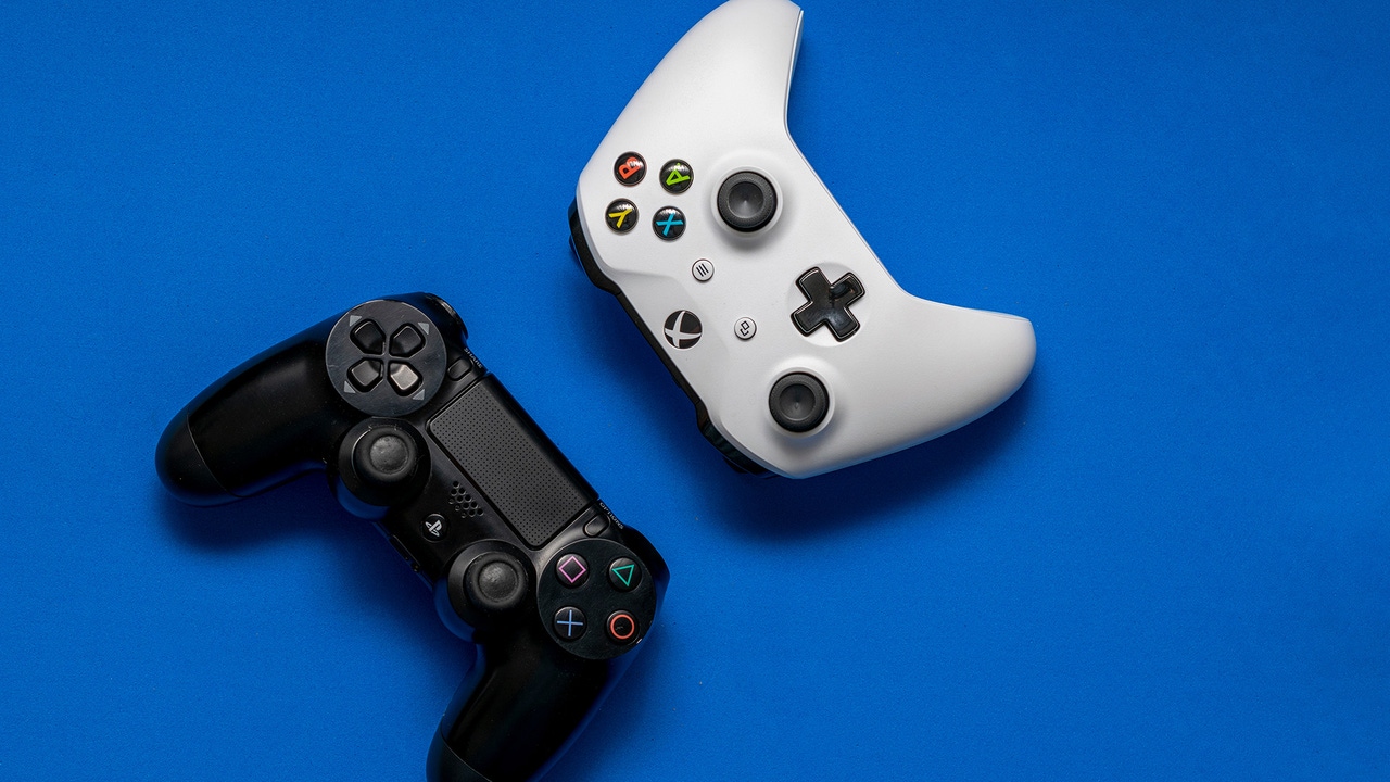 Photos of a PS3 and Xbox One controller. Photos of a PS3 and Xbox One controller.