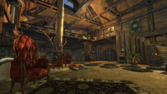 A player Homestead interior in Guild Wars 2. A high-backed red chair is in the foreground.