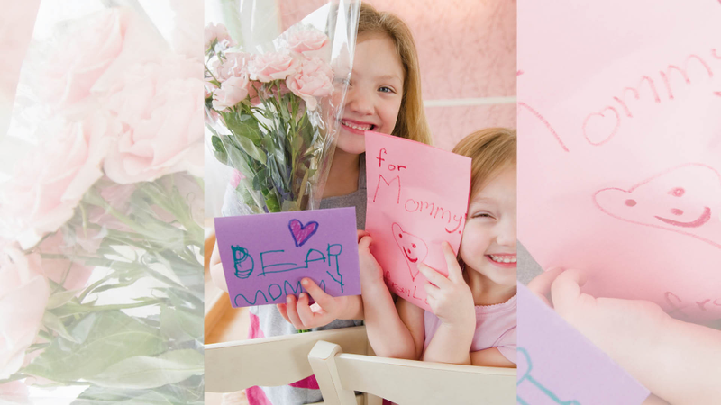 Two children with Mother’s Day cards Two children with Mother’s Day cards