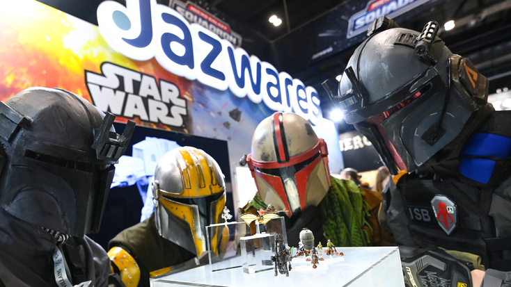 Cosplayers dressed as Mandalorians viewing the Star Wars Micro Galaxy Squadron Scout Class Mystery Packs by Jazwares.