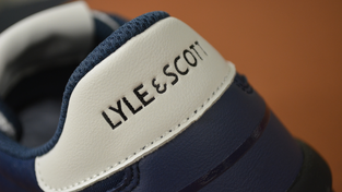 Lyle & Scott branding on a pair of shoes.