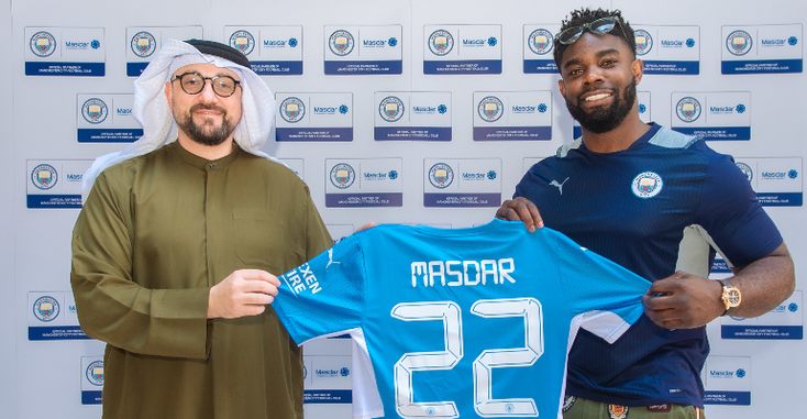 Mohamed Jameel Al Ramahi holding a Manchester City Jersey with Masdar on the back Mohamed Jameel Al Ramahi holding a Manchester City Jersey with Masdar on the back