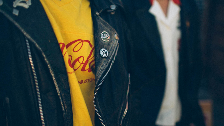 Coca-Cola x Brixton classic football tee in yellow and bunker block spring/summer woven in Coke Red.