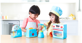 Two children playing with the new Tasty Jr. toys 