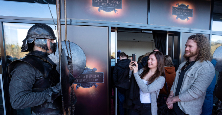 Two visitors walking into the "Game of Thrones" Studio Tour Two visitors walking into the "Game of Thrones" Studio Tour