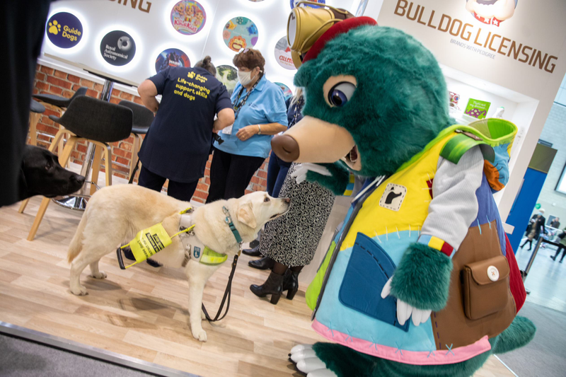 A character meets a friend on the show floor. A character meets a friend on the show floor.
