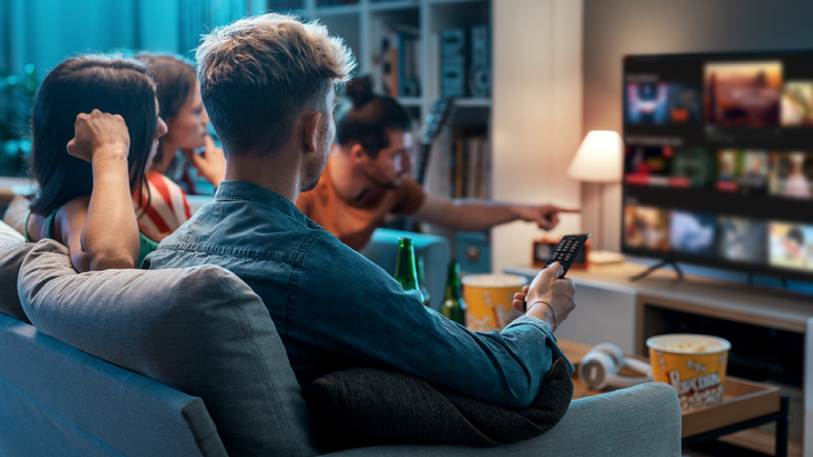 Friends gathered to watch streaming TV Friends gathered to watch streaming TV