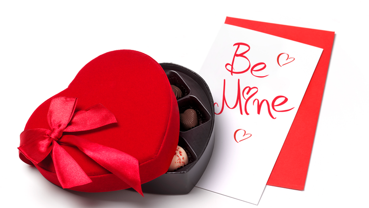 A box of chocolates and a card reading "Be Mine."