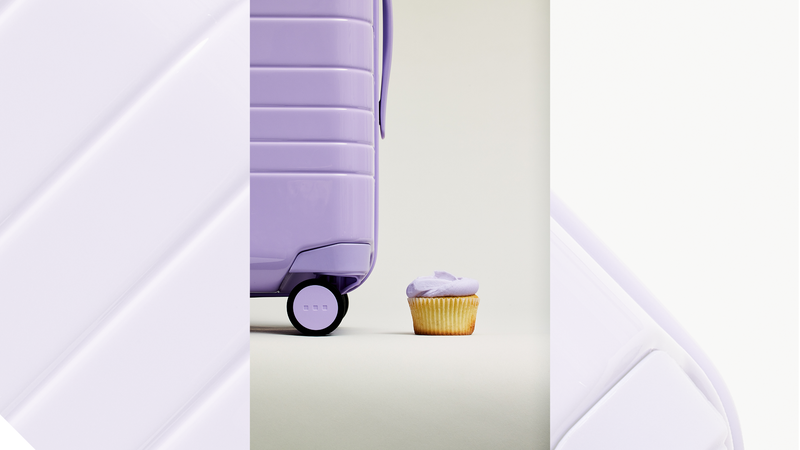 Monos purple luggage alongside Magnolia Bakery's purple icing. Monos purple luggage alongside Magnolia Bakery's purple icing.