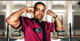 A model wearing the limited-edition collection from Champion celebrating Muhammad Ali