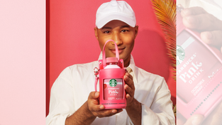 Brandon Blackwood with the pink sling bottle bag.
