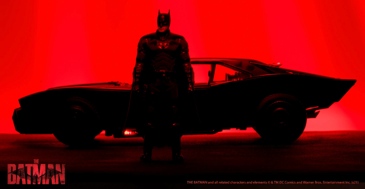 A promotional image for the Diecast Batmobile replica