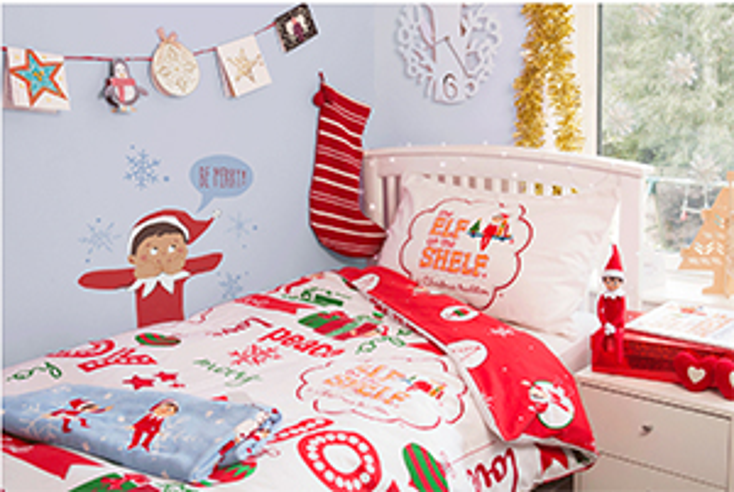 Elf on the Shelf Sits on Home Textiles