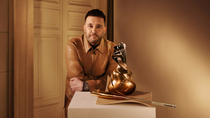 Kim Jones alongside the Hennessy X.O limited-edition bottle. 