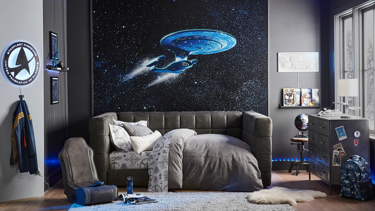 A bedroom featuring products from the “Star Trek” and Pottery Barn Teen collection. A bedroom featuring products from the “Star Trek” and Pottery Barn Teen collection.