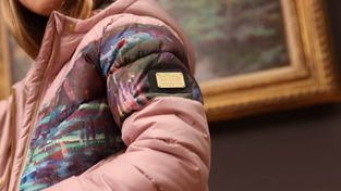 Children’s puffer jacket featuring a plate embossed with the London Fog x Monet.