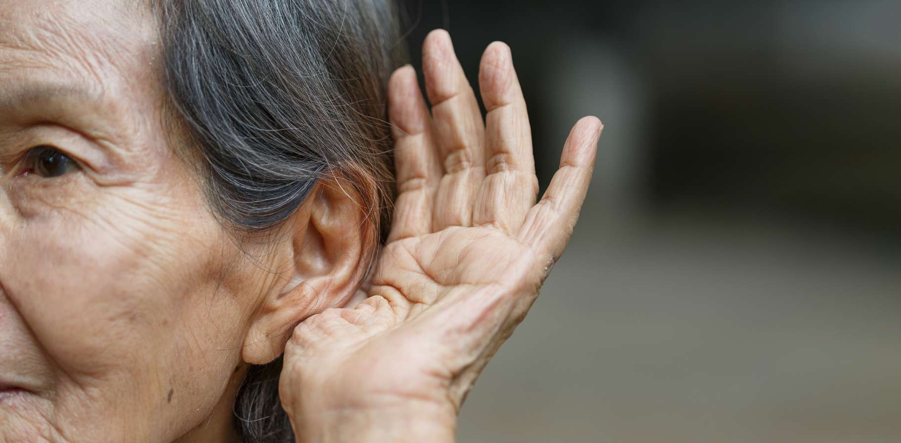 desktop banner 1821x896-Elderly-Woman-Hearing-Loss-H-409132105.jpg