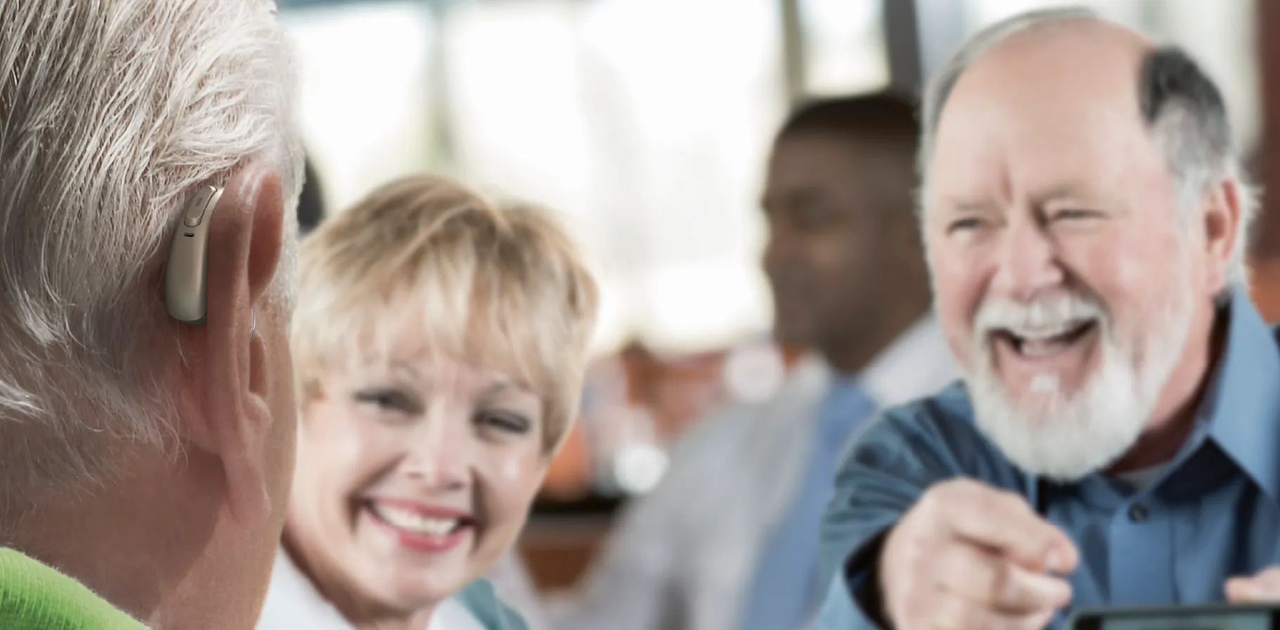 Desktop Banner 1821x896_Man_HearingAids_Restaurant-100.jpg