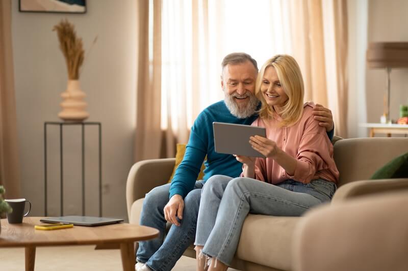 cheerful-couple-using-tablet.jpg