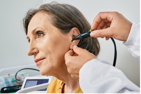 Woman_getting_ear_exam.jpg