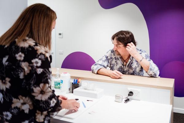 TritonCarePlus fixing hearing aid.jpg