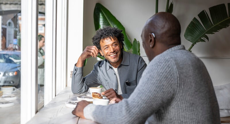 men-chatting-in-coffee-shop.jpg