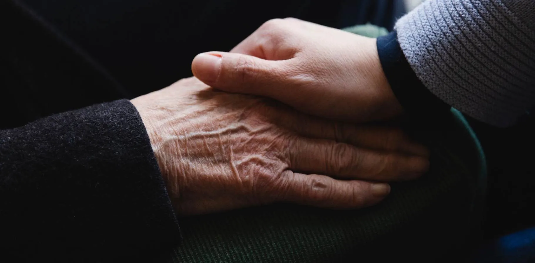 desktop banner 1821x896_AN-24_Brand_CloseupHoldingHands_Stocksy_3661095.jpg