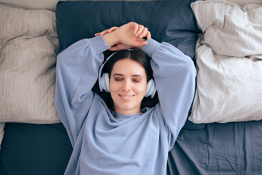 bigstock-relaxed-woman-wearing-headphon-413922767.jpg