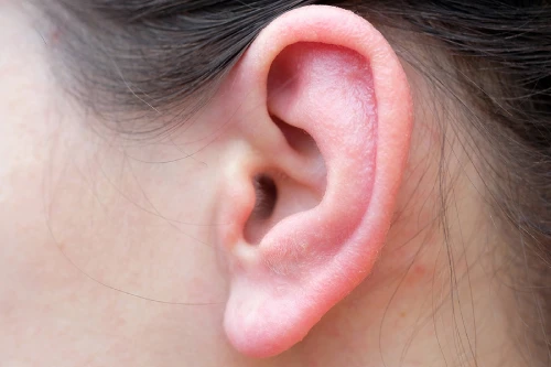bigstock-girls-ear-closeup-sore-red-ea-350331031.jpg