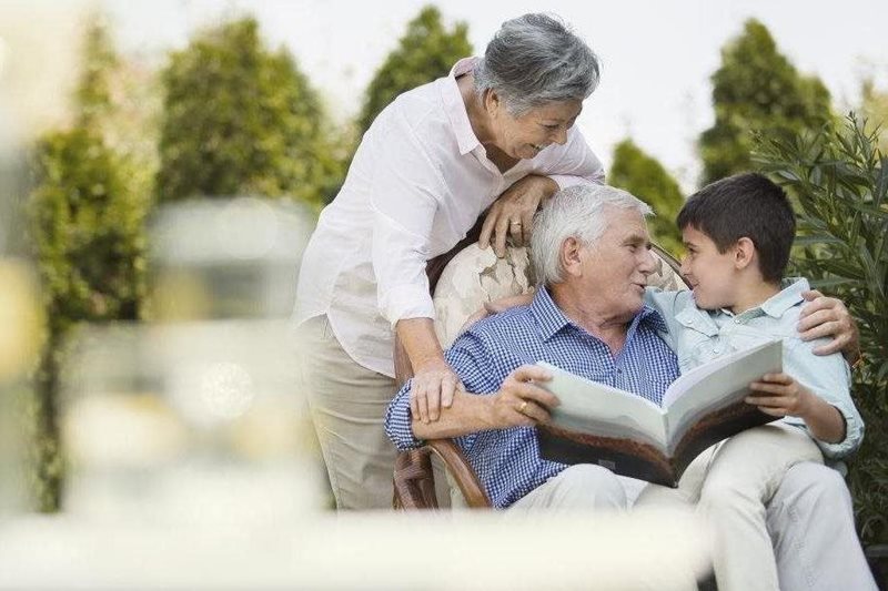 grandparents-with-kid-reading-book.jpg