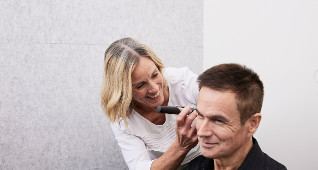 audiologist-checking-clients-ear.png
