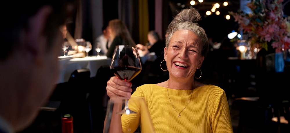 Woman-holding-wine-glass-at-restaurant.jpg