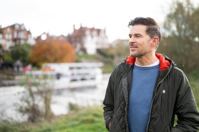 man-walking-next-to-river.jpg