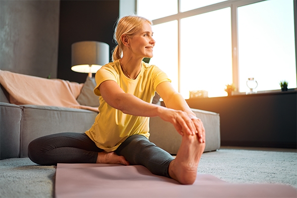 A woman relieves her insomnia and hearing loss by doing yoga and lowering her stress