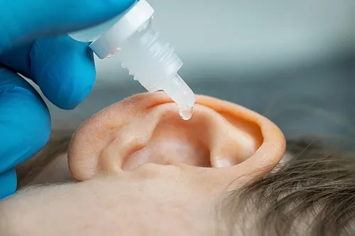 doctor-dripping-ear-drops-500.jpg