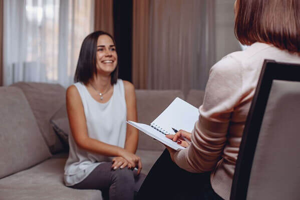 woman-smiling-during-therapy-session-inline-image.jpg