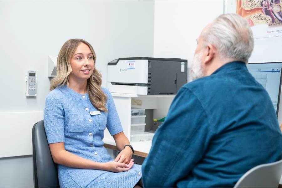 audiologist-talking-to-man.jpg