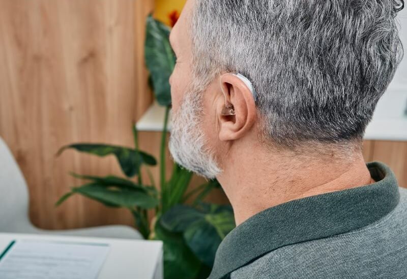 senior-man-with-hearing-aid.jpg