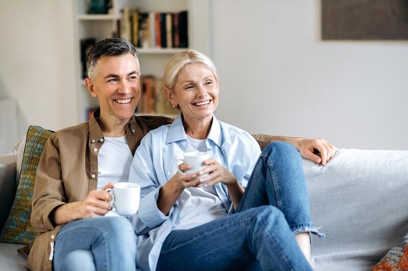 couple-cuddling-on-sofa.jpg