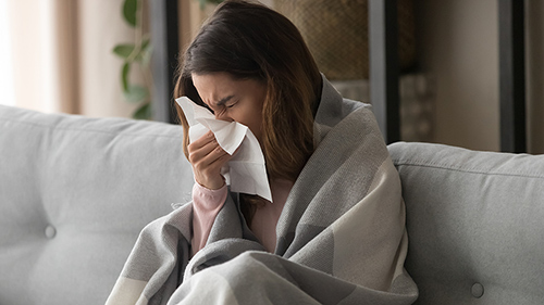 sick-girl-blowing-nose-feeling.jpg
