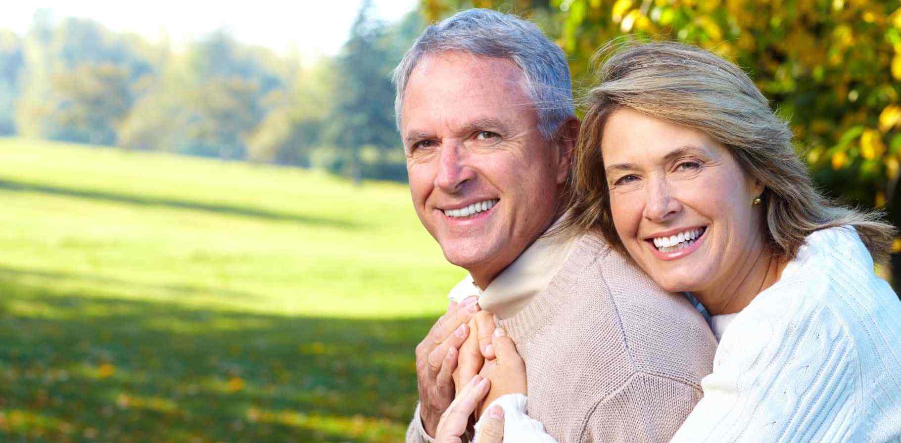 senior-couple-hugging-nature.jpg